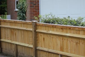 Low wooden fence installer